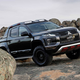 Illustration for article titled The Mitsubishi Triton Absolute Will Not Apologize for All That Carbon Fiber